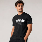 Man wearing a black t-shirt with humorous text on a plain background