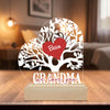 Personalized decorative plaque with heart design and engraved text on a wooden stand.