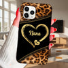Phone case with leopard print and 'Nana' in a heart on a black background held by a person.